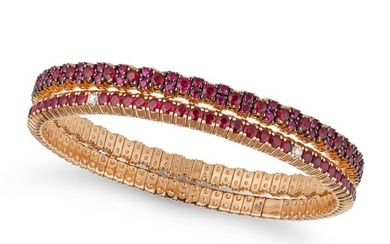 A PAIR OF RUBY AND DIAMOND BANGLES each of elasticated design, one set with round cut rubies, the
