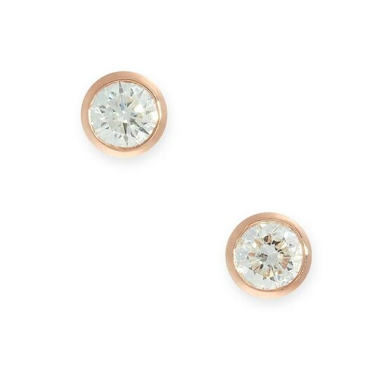 A PAIR OF SOLITAIRE DIAMOND STUD EARRINGS in 18ct rose