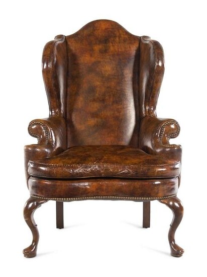 A Queen Anne Style Faux Leather Upholstered Wingback