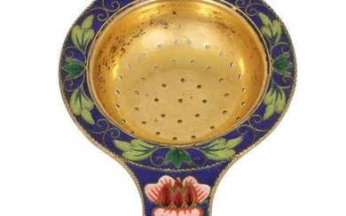 A RUSSIAN GILT SILVER AND CLOISSONE ENAMEL TEA STRAINER