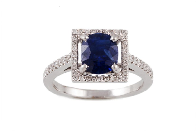 A SAPPHIRE AND DIAMOND FANCY CLUSTER RING, with one oval cut...