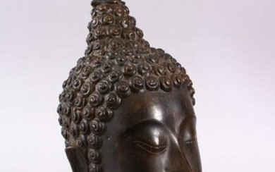 A THAI BRONZE FIGURE OF A HEAD, upon a fitted stand