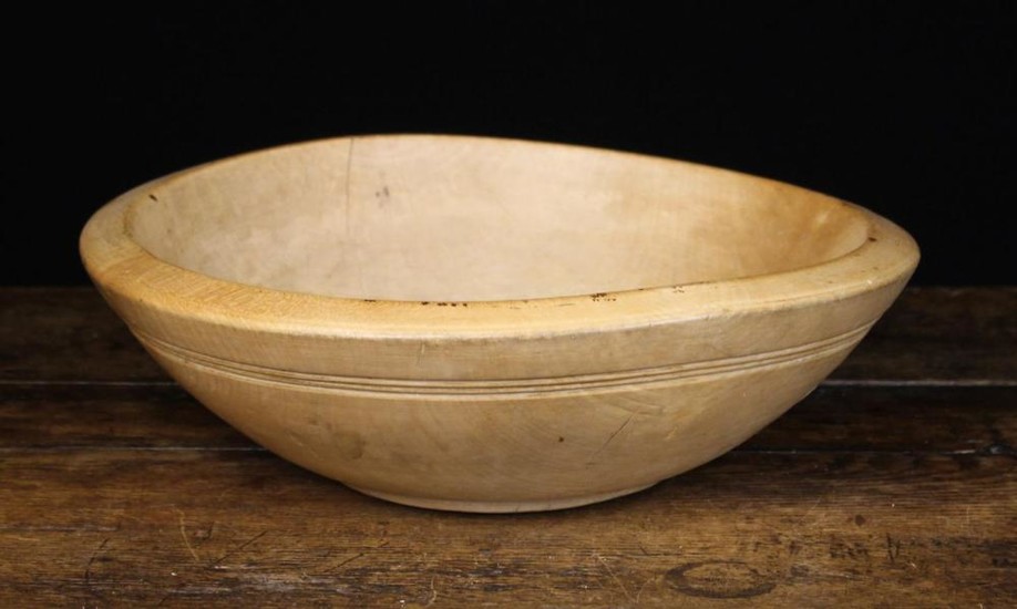 A Turned Sycamore Dairy Bowl, 11 cm high, 37 cm in diameter (4½'' h. 14½'' dia.)