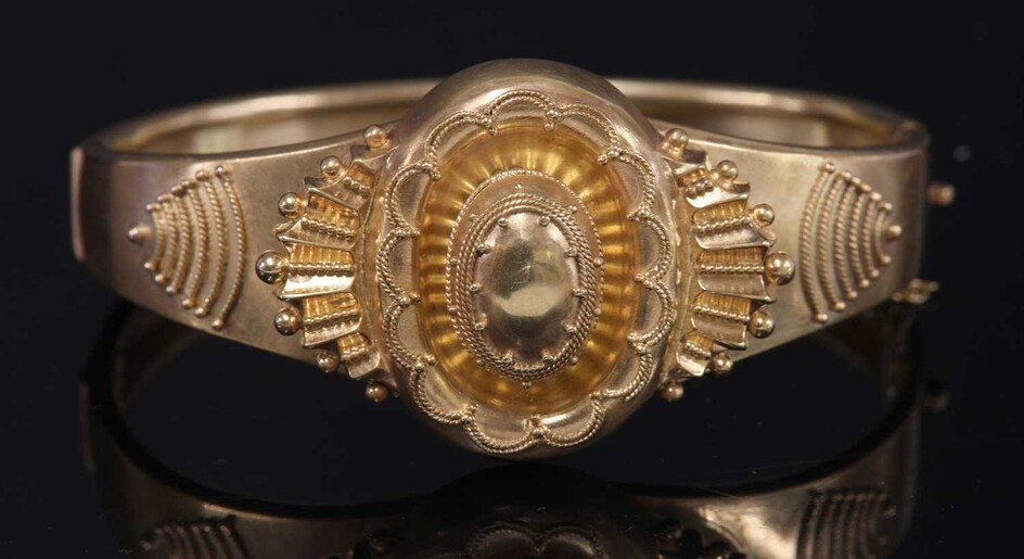 A Victorian Etruscan Revival gold bangle, c.1870