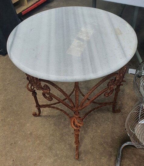 A WROUGHT IRON BASED TABLE