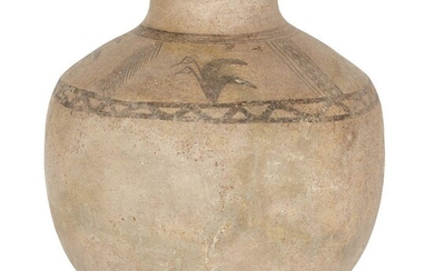 A buff pottery vessel, the sloping shoulders decorated in added umber with four pairs of aquatic birds in flight, divided by two vertical bands of feather patterning and two vertical bands of lozenges within lines, bordered above by encircling...