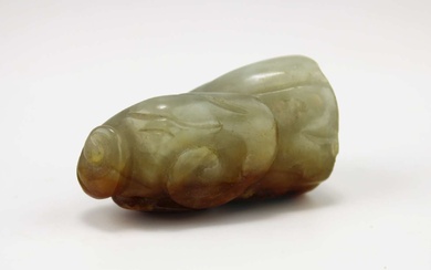 A carved russet jade lotus pod and lingzhi pendant