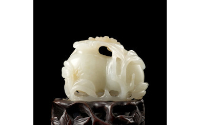 A celadon and russet jade pomegranate group, wood base (defects and losses) China, 19th/20th century (l. 5 cm.)