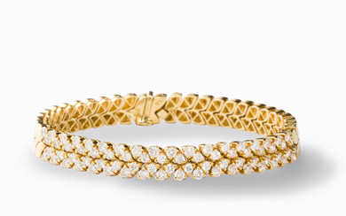 A diamond and eighteen karat gold bracelet
