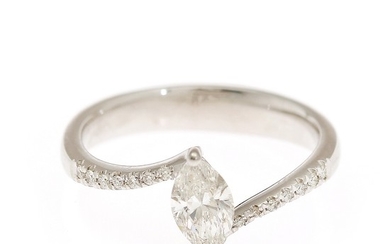 A diamond ring set with a marquise-cut diamond flanked by numerous brilliant-cut diamonds, mounted in 14k white gold. Size 53.