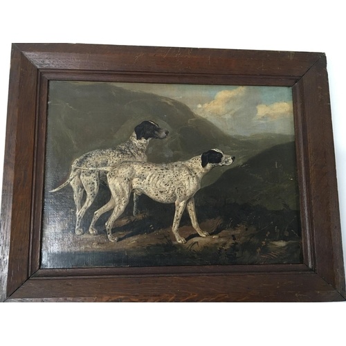 A framed 19th century oil painting on canvas study of two do...