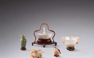 A group of four carved agate implements and a spinach-green...