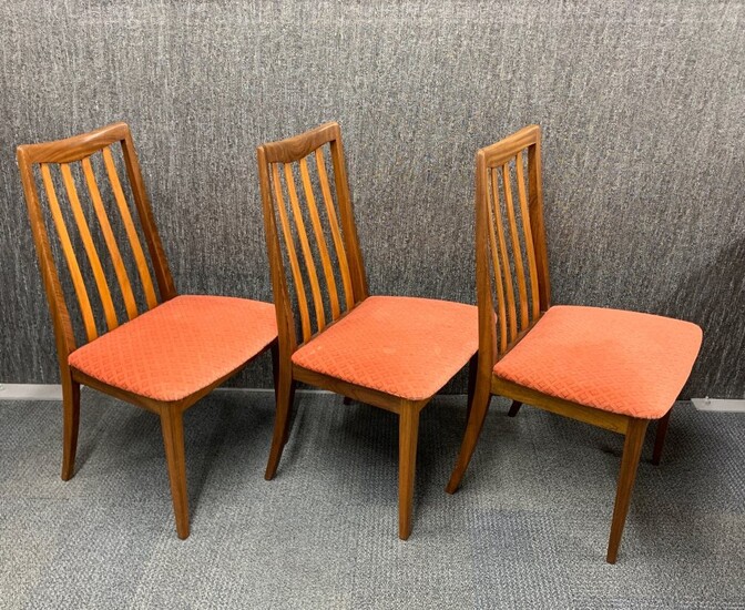 A group of three G-Plan dining chairs.