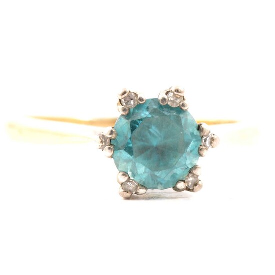 A heat treated blue zircon ring and diamond ring.