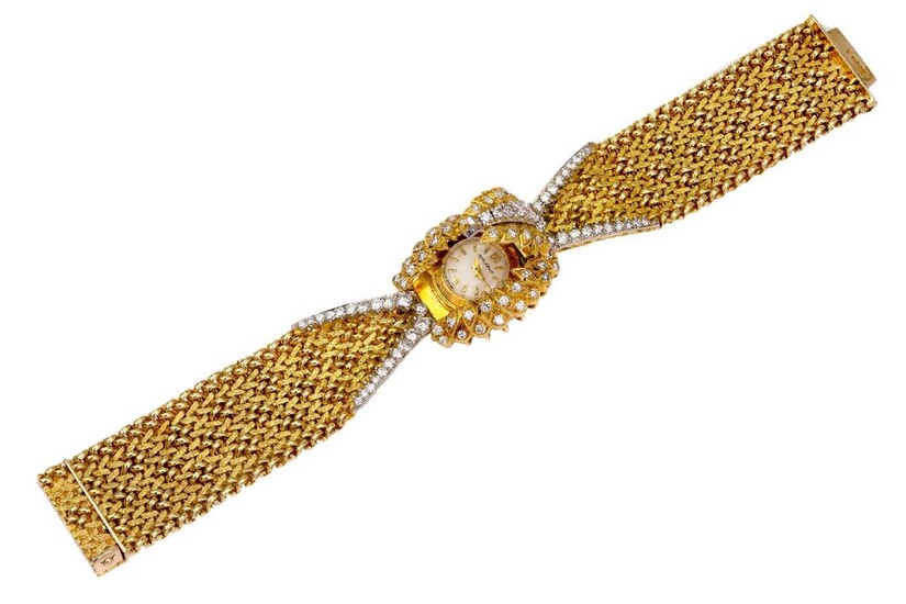 A lady’s 18ct gold diamond set bracelet watch, by Jaeger LeCoultre, for Kutchinsky, with central brilliant-cut diamond hinged dial cover and diamond decoration to the shoulders, jewelled lever back wind movement to tapering textured strap design...