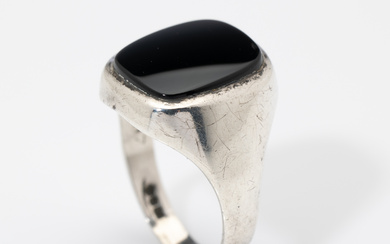 A large English hallmarked sterling silver and onyx signet ring,...