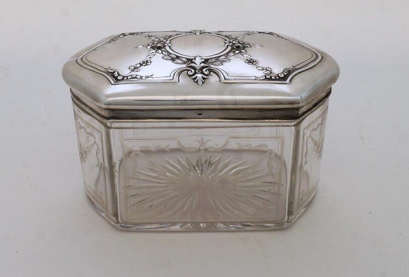 A large French white metal mounted glass vanity box, with Minerva 950 mark, the lid repousse decorated with central vacant cartouche within floral swags and foliage, the glass box acid etched with floral swags, 10.5cm high, 19cm wide, 12cm deep...