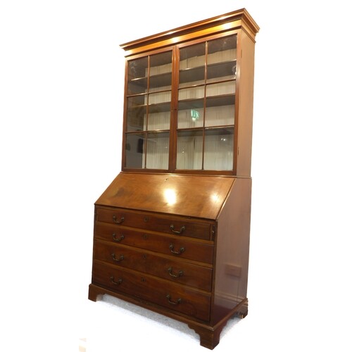 A large George III period mahogany bureau bookcase; the outs...