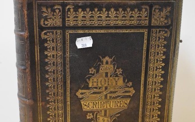 A late 19th Century family bible, leather bound with commentaries of Henry & Scott
