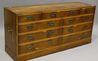 A late 20th century yew and brass bound campaign style chest of twelve drawers, height 71cm, width 1