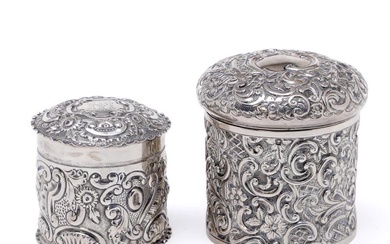 A late Victorian sterling silver box embossed with flowers and scrolls, maker James Deakin & Sons (John & William F Deakin) 1896 H. 8.5 cm, and another one by Deakin & Francis Ltd, Birmingham 1892 H. 6.5 cm. (2)