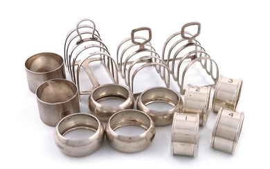 A mixed lot of silver items, various dates and makers, comprising: three toast racks, a set of four napkin rings, Birmingham 1928, of D form, numbered 1-4, another set of four napkin rings, and a pair of napkin rings, approx. weight 12.2oz. (qty)