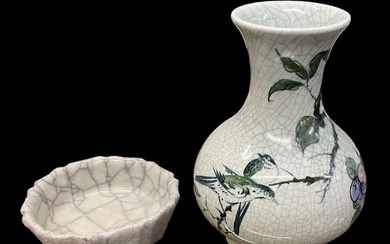 A modern Chinese celadon glazed floral decorated vase, height 18.5cm,...