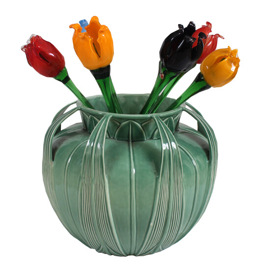 A modern green glazed jar with colored glass tulip flower