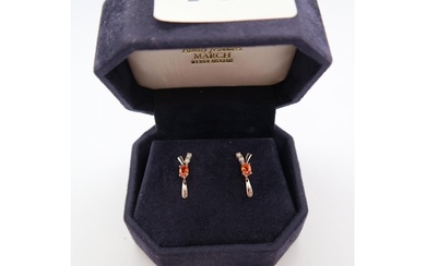 A pair of 18ct white gold orange sapphire and diamond earrin...