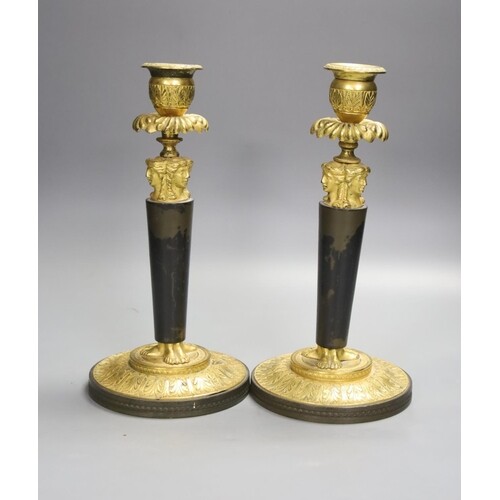 A pair of 19th century bronze and ormolu figural candlestick...