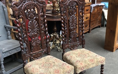 A pair of 19th century oak hall chairs, in Jacobethan taste,...