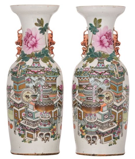 A pair of Chinese famille rose vases, decorated...