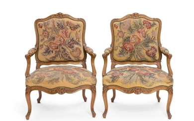 A pair of Louis XV style beechwood fauteuils