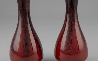 A pair of Sevres oxblood red vases, 8 1/2 in. (21.59 cm.) h.