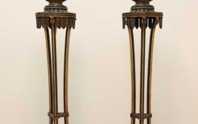 A pair of carved and painted torchères