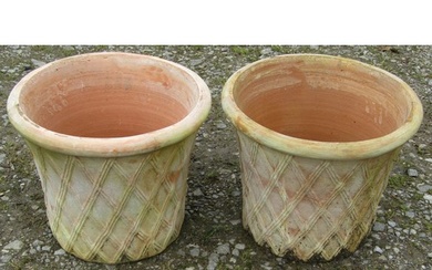 A pair of contemporary terracotta planters in the form of la...