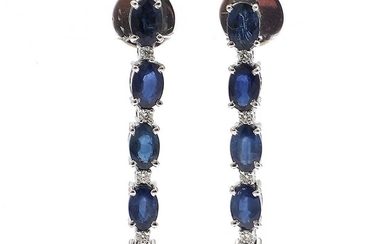 A pair of diamond and sapphire ear pendants each set with five oval-cut sapphires and five brilliant-cut diamonds, mounted in 14k white gold. L. 4 cm. (2)