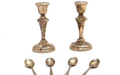 A pair of silver candlesticks with knopped tapering stem