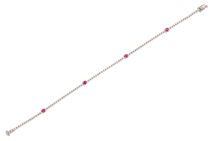 A ruby and diamond line bracelet Composed of...