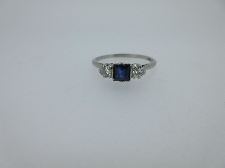 A sapphire and diamond three stone ring