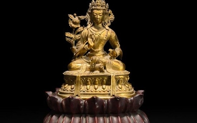 A small Sino-Tibetan gilt-bronze figure of a