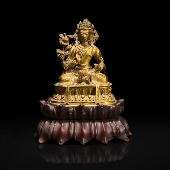 A small Sino-Tibetan gilt-bronze figure of a