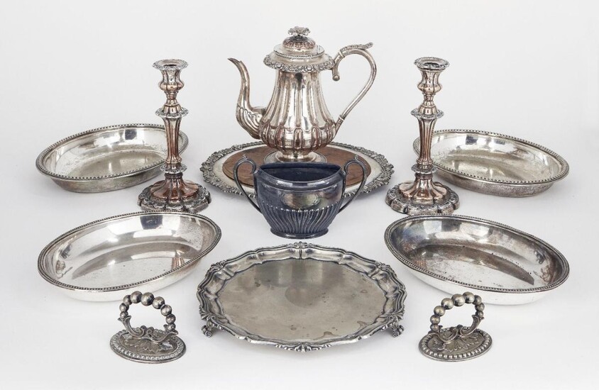 A small quantity of silver plate comprising: a pair of entrée dishes; a bread board with wooden insert to gadrooned silver plated dish; a shaped circular salver; a hot water pot and a pair of candlesticks (a lot)