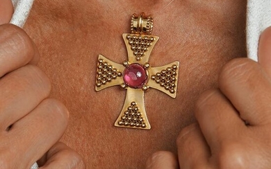 A tourmaline and gold cross pendant by CHANEL.