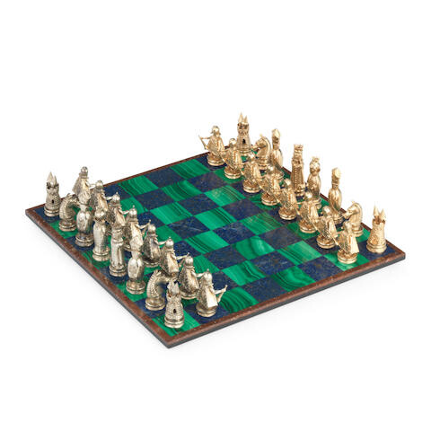 A yellow metal figural chess set