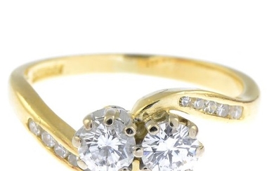 An 18ct gold diamond crossover ring.Estimated total diamond...