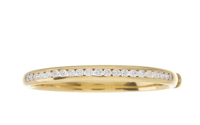 An 18ct gold diamond line bangle bracelet