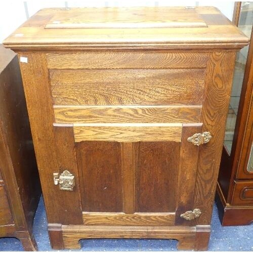 An American 20thC oak Ice Box, with hinged top enclosing lea...