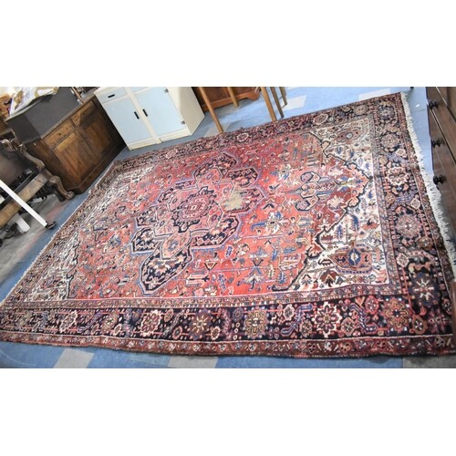 An Antique Hand Made Persian Heriz Carpet, 360x273cms