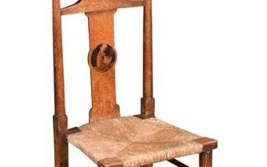 An Arts and Crafts oak 'nursery-rhyme' chair by Liberty